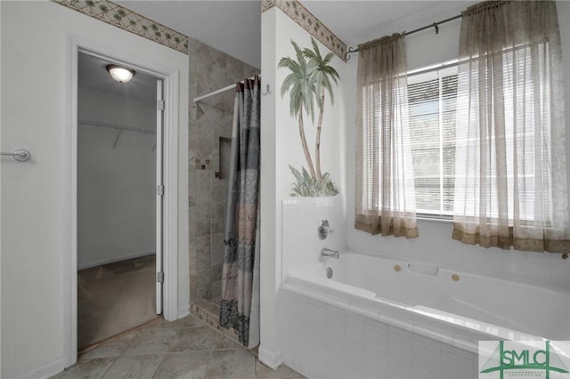 bathroom featuring separate shower and tub