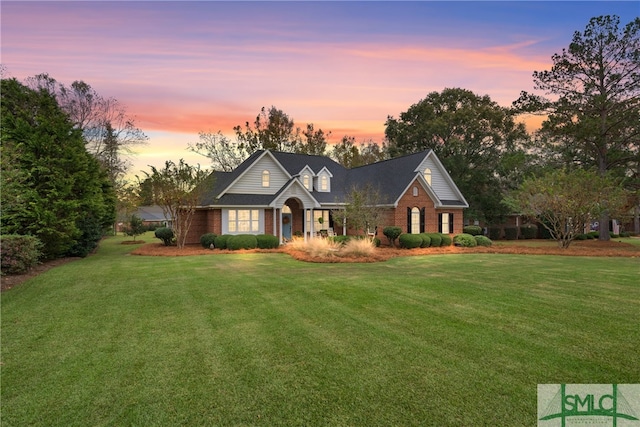 cape cod-style house with a yard