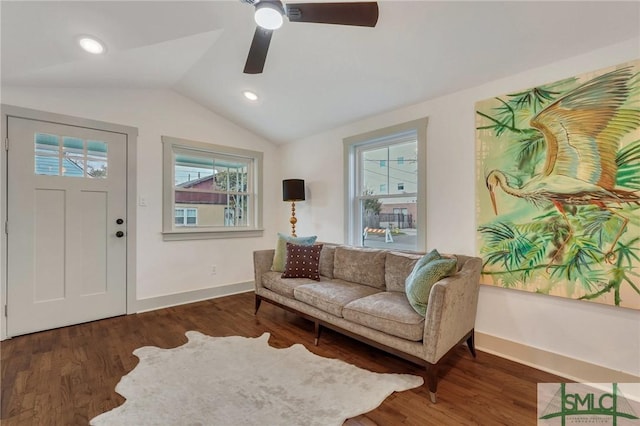 sitting room featuring a wealth of natural light, wood finished floors, baseboards, and vaulted ceiling