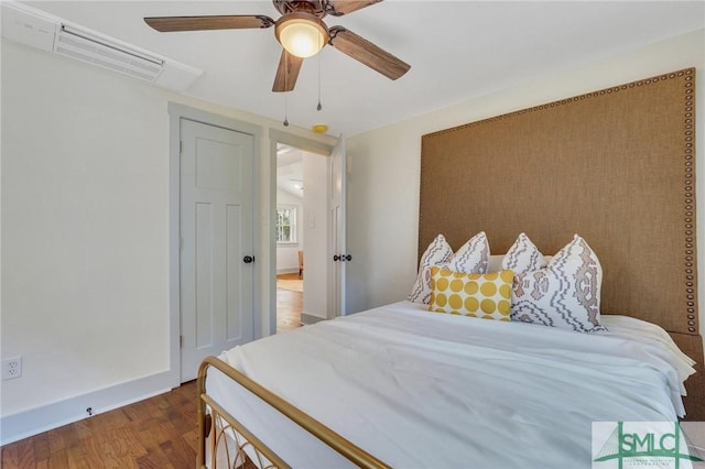 bedroom with wood finished floors and ceiling fan