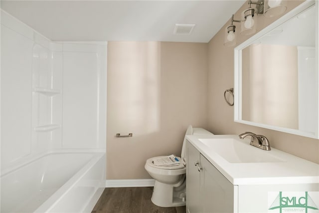 bathroom featuring hardwood / wood-style flooring, vanity, and toilet