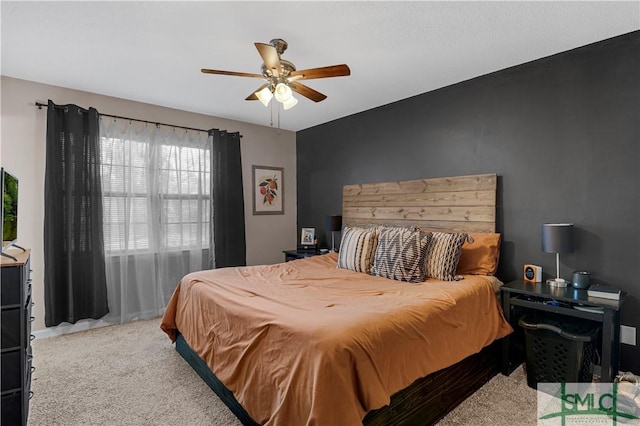 carpeted bedroom with ceiling fan