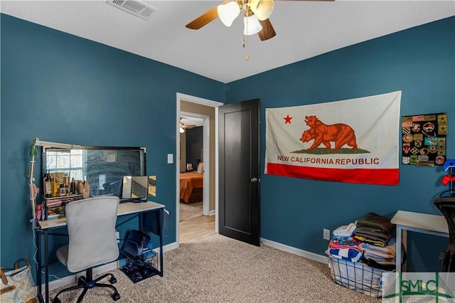 home office featuring carpet flooring and ceiling fan