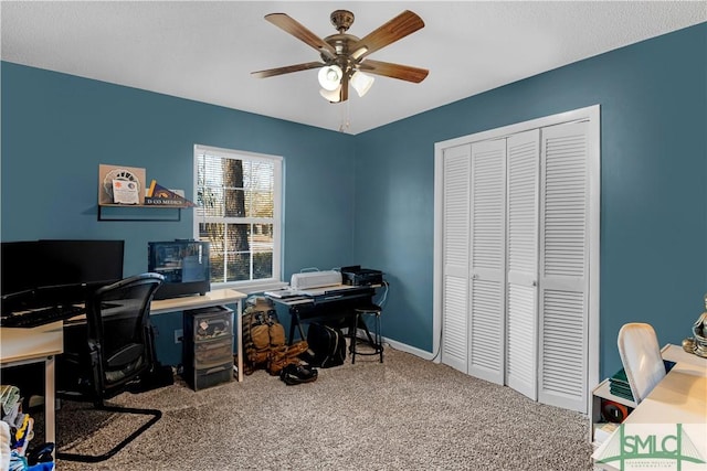 home office with ceiling fan and carpet floors