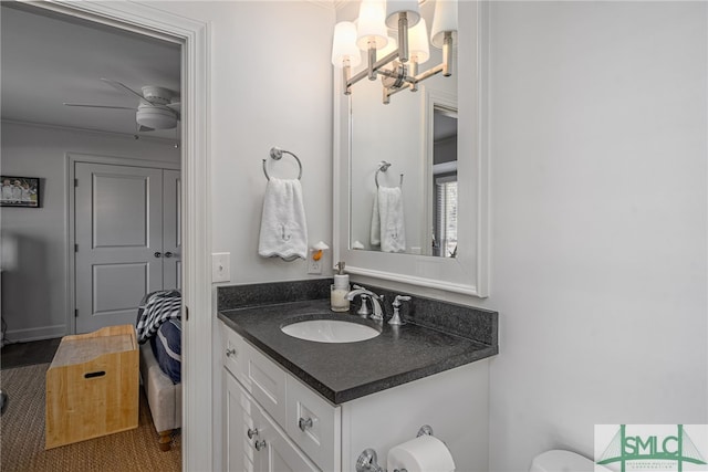 half bath featuring a ceiling fan and vanity