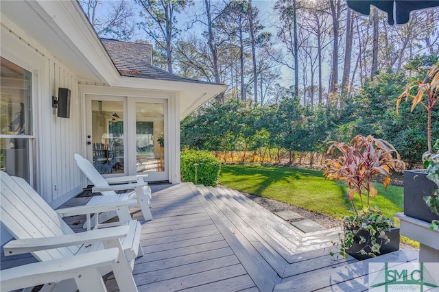 wooden terrace with a lawn