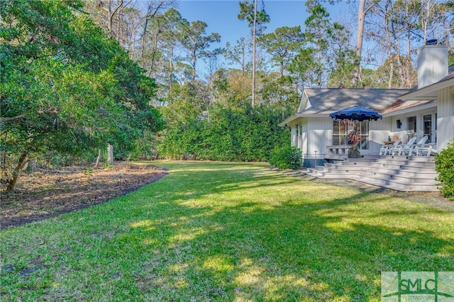 view of yard with a wooden deck