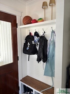 mudroom featuring crown molding