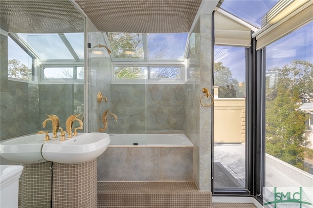 bathroom with tiled bath