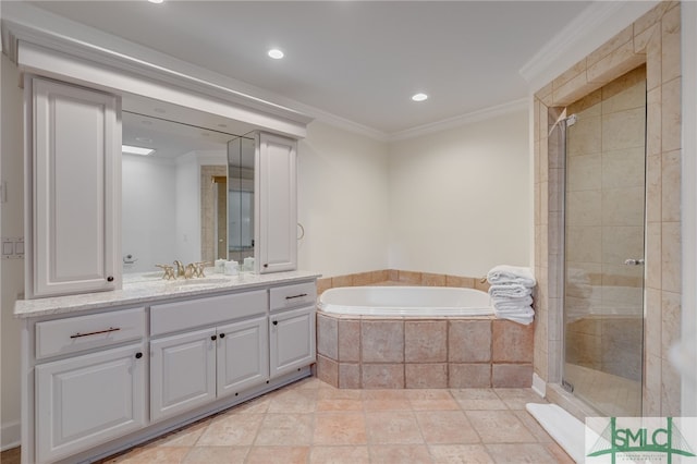 bathroom featuring ornamental molding, separate shower and tub, and vanity