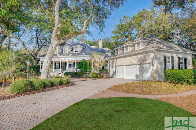 view of front of home with a garage and covered porch