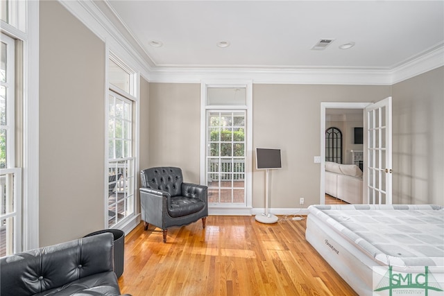 bedroom featuring crown molding and hardwood / wood-style floors