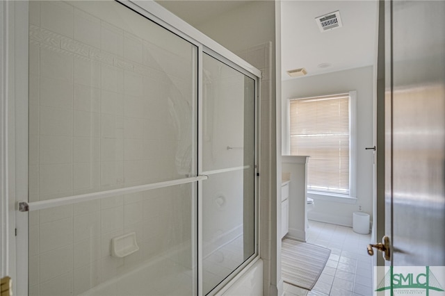 bathroom with vanity, tile patterned floors, and toilet