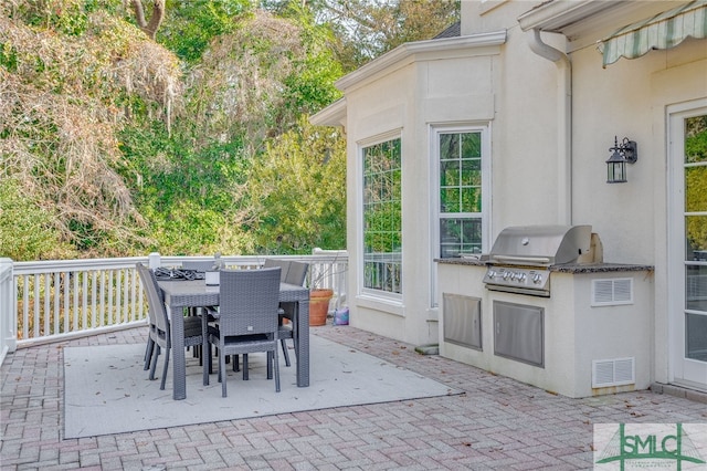 view of patio / terrace featuring an outdoor kitchen and area for grilling