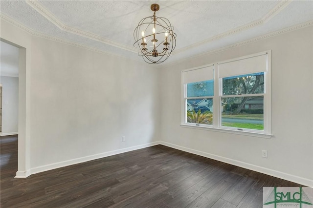 empty room with an inviting chandelier, ornamental molding, dark hardwood / wood-style floors, and a textured ceiling