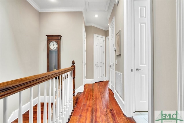 corridor featuring light hardwood / wood-style flooring and ornamental molding