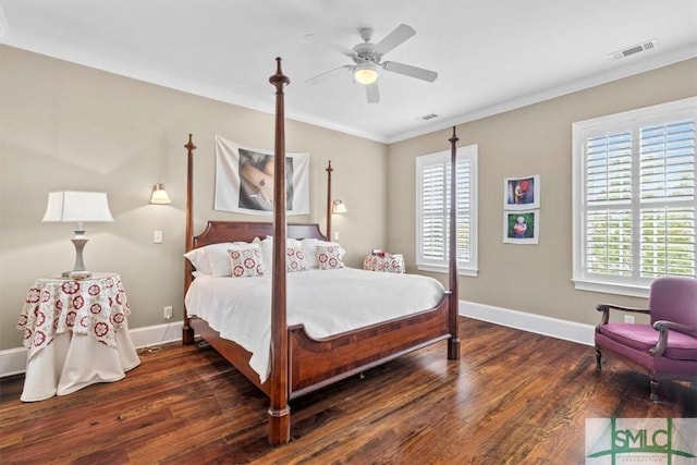 bedroom with ornamental molding, ceiling fan, and dark hardwood / wood-style flooring