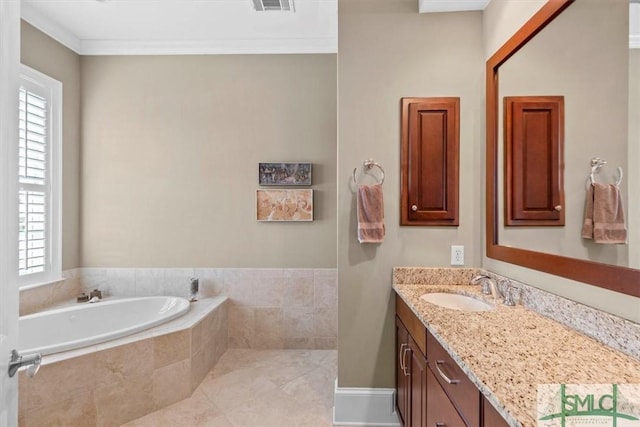 bathroom with ornamental molding, vanity, tile patterned flooring, and tiled tub