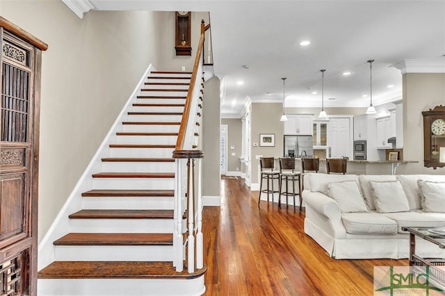 living room featuring crown molding and dark hardwood / wood-style floors