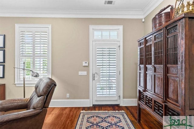 doorway with dark wood-type flooring and ornamental molding