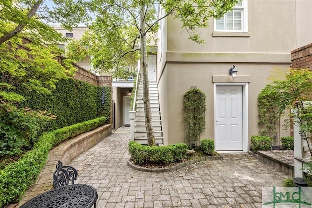 entrance to property featuring a patio area