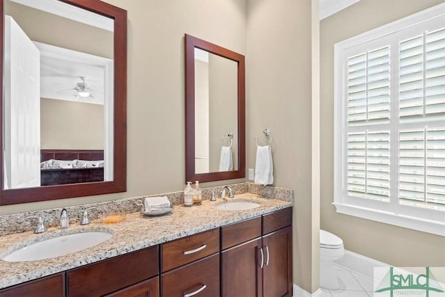 bathroom with vanity and toilet