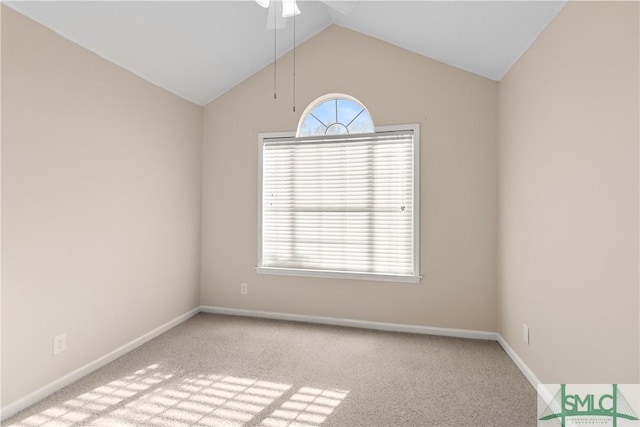 unfurnished room featuring vaulted ceiling and light carpet