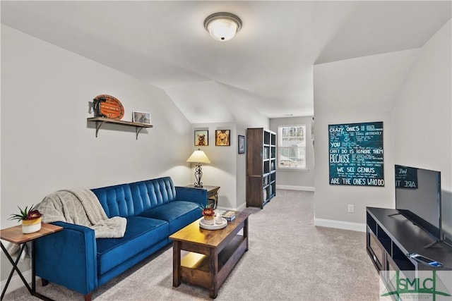 living room featuring light carpet, vaulted ceiling, and baseboards