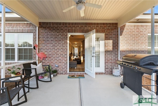 view of patio / terrace featuring a grill and a ceiling fan