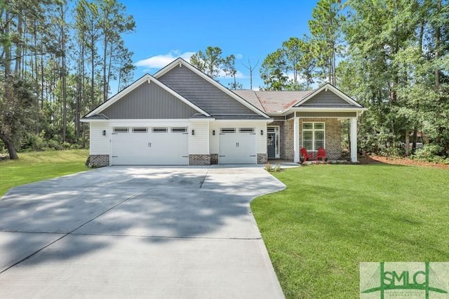 craftsman-style house featuring a garage and a front lawn