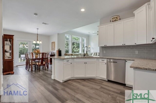 kitchen with sink, white cabinets, and dishwasher