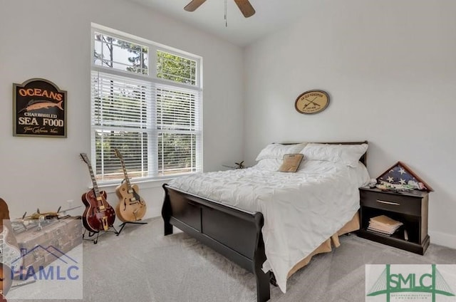 bedroom with light colored carpet and ceiling fan