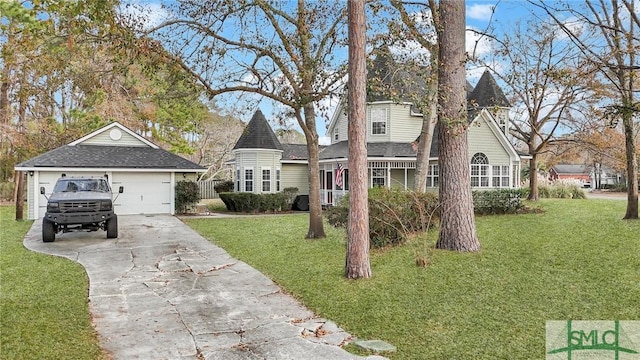 victorian home featuring a garage and a front yard