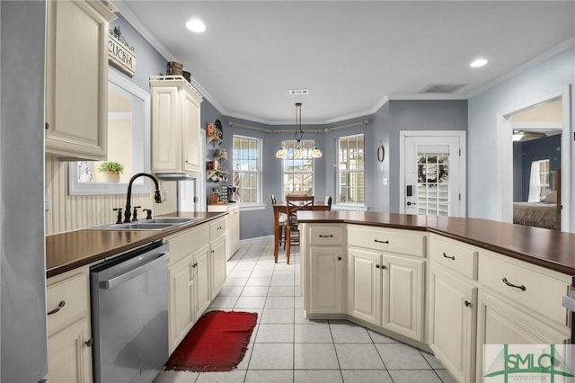 kitchen featuring light tile patterned flooring, pendant lighting, sink, stainless steel dishwasher, and crown molding