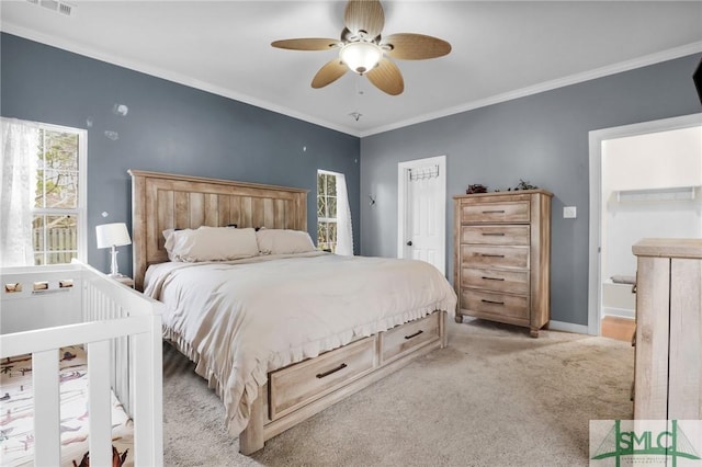 bedroom featuring ceiling fan, light colored carpet, and ornamental molding