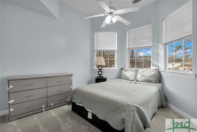 bedroom with light colored carpet and ceiling fan