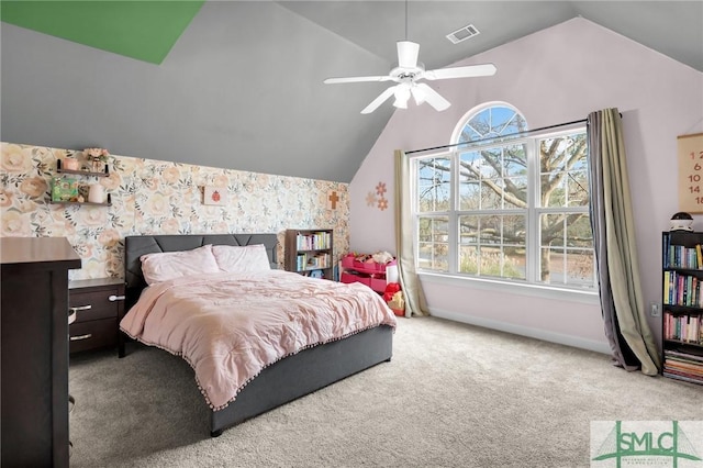 carpeted bedroom featuring ceiling fan and vaulted ceiling