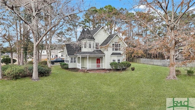 view of front of property with a front lawn and covered porch