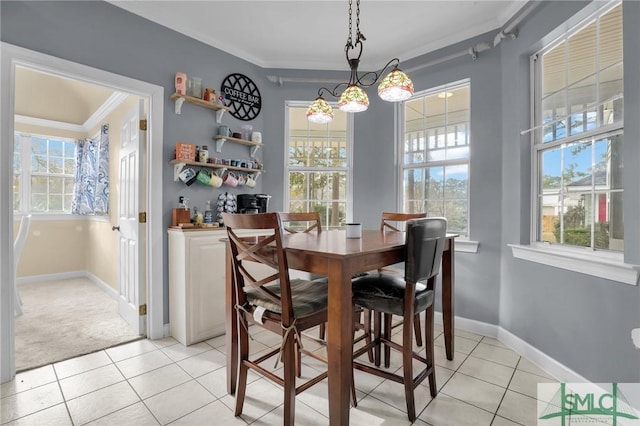 tiled dining area featuring ornamental molding