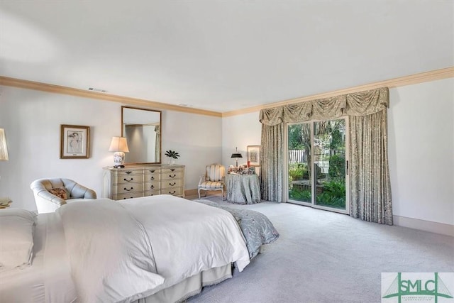 bedroom with crown molding, access to exterior, and carpet floors