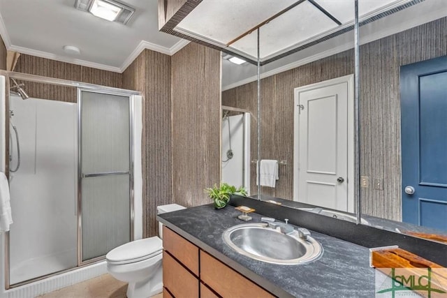 bathroom featuring an enclosed shower, ornamental molding, vanity, and toilet