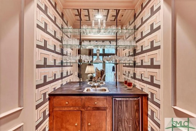 bar with sink and crown molding