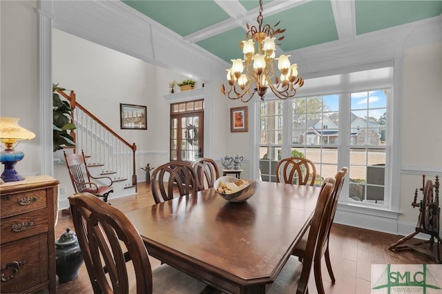 dining area featuring coffered ceiling, hardwood / wood-style flooring, beam ceiling, and a chandelier