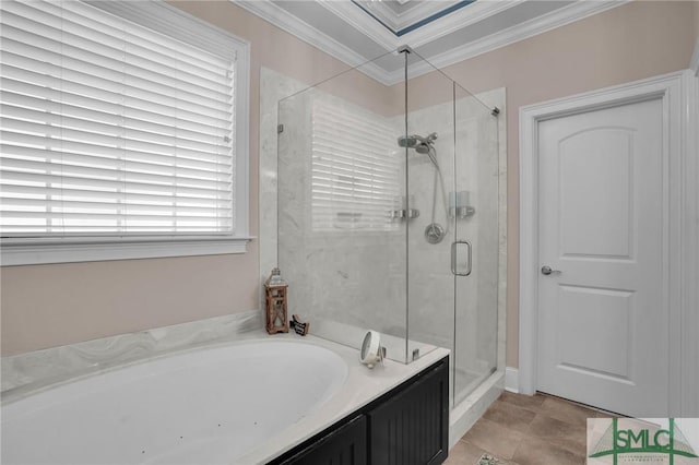 bathroom featuring ornamental molding and separate shower and tub