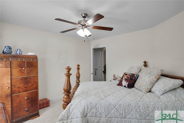 bedroom with ceiling fan and light carpet