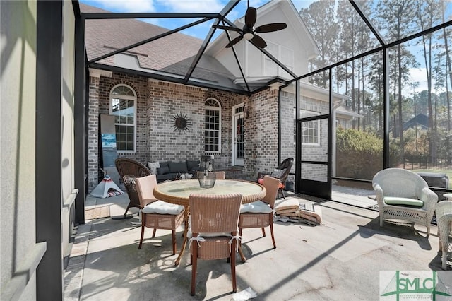 sunroom featuring a wealth of natural light and ceiling fan