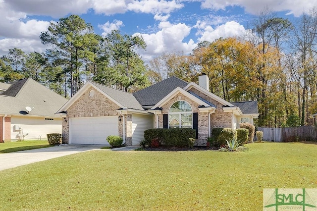 view of front of house with a garage and a front lawn