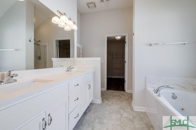 bathroom featuring vanity and separate shower and tub