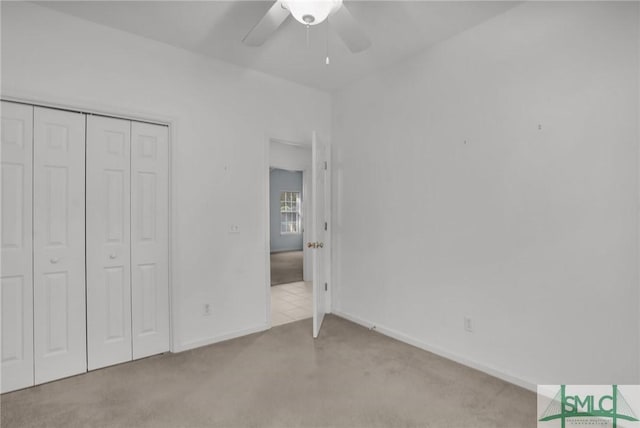 unfurnished bedroom featuring a closet and ceiling fan