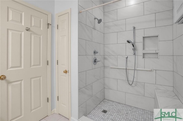 bathroom featuring tiled shower